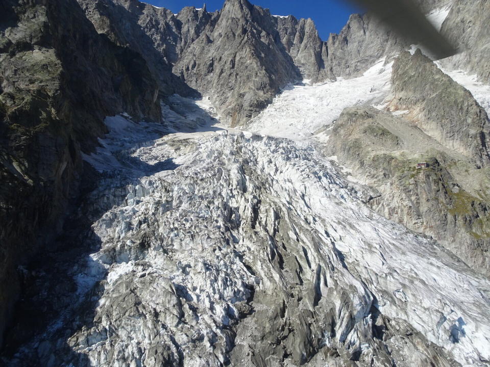 This photo taken on Friday, Sept. 20, 2019 shows the massive Planpincieux glacier, located in the Alps on the Grande Jorasses peak of the Mont Blanc massif, which straddles the borders of Italy, France and Switzerland and contains the highest peak in Western Europe. The fast-moving Italian glacier is melting quickly, threatening a picturesque valley near the Alpine town of Courmayeur and prompting the mayor to close down a mountain road. Mayor Stefano Miserocchi has forbidden access to a section of the Val Ferret, outside of Courmayeur, a popular hiking area on the south side of the Mont Blanc massif. (Comune di Courmayeur, Fondazione Montagna Sicura via AP)