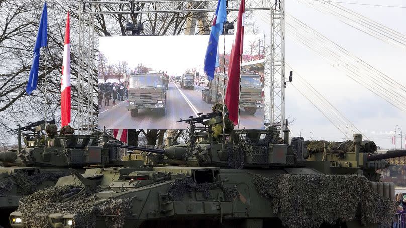 FILE Latvian Army armoured personnel carriers parade during a military parade on Latvian Independence Day, in Riga, Friday, Nov. 18, 2022.