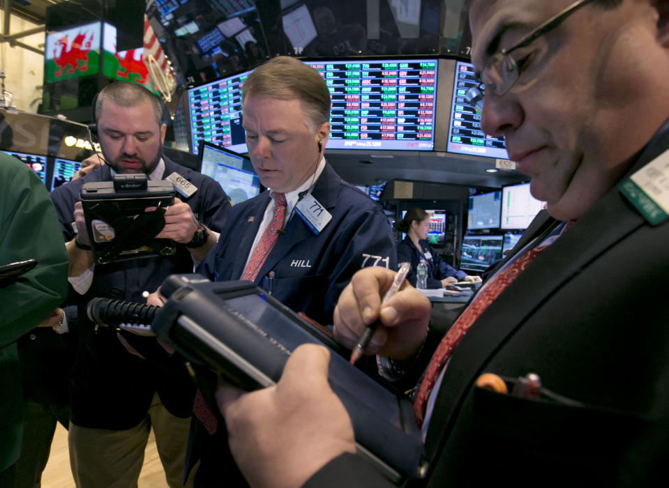 Traders work on the floor of the New York Stock Exchange, Friday, Feb. 28, 2014. U.S. stocks are opening higher, pushing the market further into record territory. (AP Photo/Richard Drew)