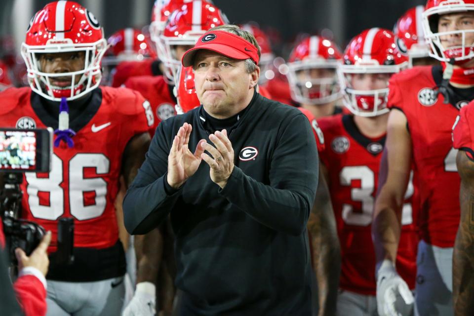 Nov 25, 2023; Atlanta, Georgia, USA; Georgia Bulldogs head coach Kirby Smart runs on the field with his team before a game against the Georgia Tech Yellow Jackets at Bobby Dodd Stadium at Hyundai Field. Brett Davis-USA TODAY Sports