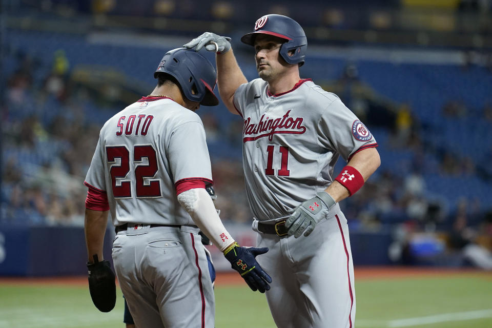 Washington Nationals' Ryan Zimmerman (11) celebrates his two-run home run off Tampa Bay Rays relief pitcher Jeffrey Springs with Juan Soto (22) during the fifth inning of a baseball game Wednesday, June 9, 2021, in St. Petersburg, Fla. (AP Photo/Chris O'Meara)