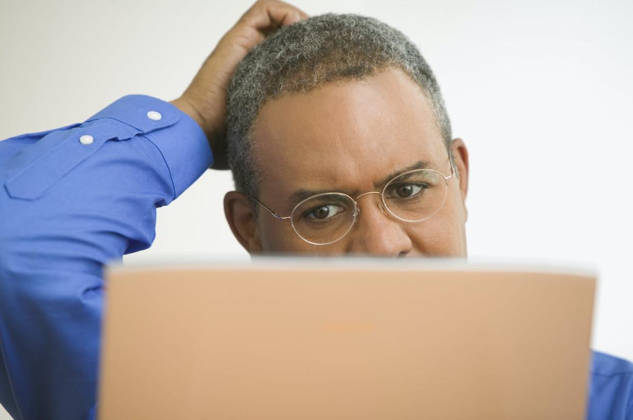 <span class="caption">If your gut says something is off about an email message, stop and investigate.</span> <span class="attribution"><a class="link " href="https://www.gettyimages.com/detail/photo/close-up-of-mature-man-with-laptop-scratching-head-royalty-free-image/57226133" rel="nofollow noopener" target="_blank" data-ylk="slk:Jose Luis Pelaez Inc/DigitalVision via Getty Images;elm:context_link;itc:0;sec:content-canvas">Jose Luis Pelaez Inc/DigitalVision via Getty Images</a></span>