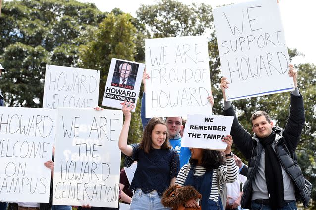 A hundred academics signed a petition urging to university to drop its plans to honour Mr Howard, but the ceremony also attracted a contingent of supporters for the former Prime Minister. Photo: AAP