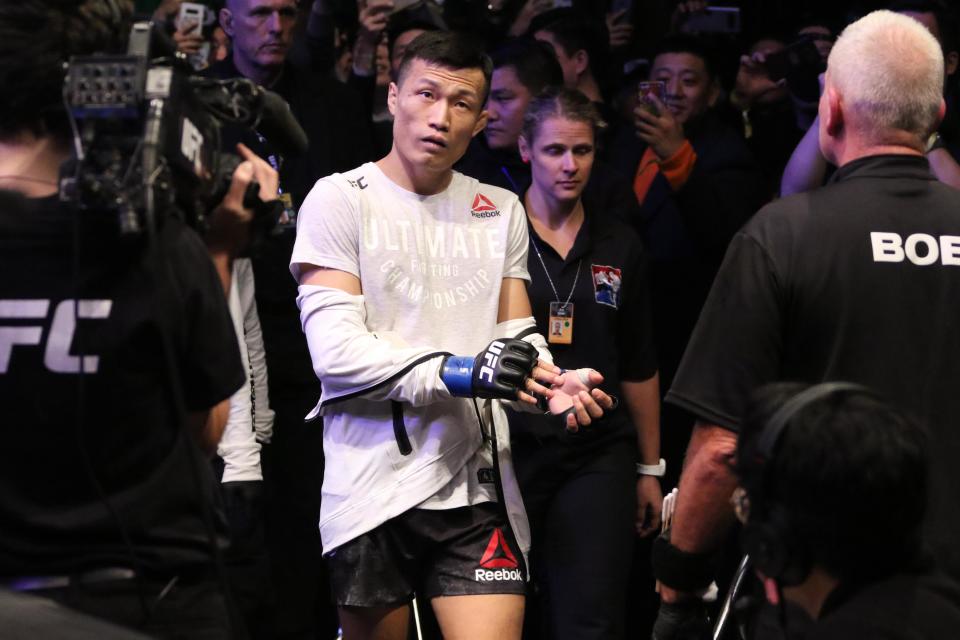 Dec 21, 2019; Busan, SOUTH KOREA; Chan Sung Jung (blue gloves) before his fight against Frankie Edgar (red gloves) during UFC Fight Night at Sajik Arena. Mandatory Credit: Jasmin Frank-USA TODAY Sports