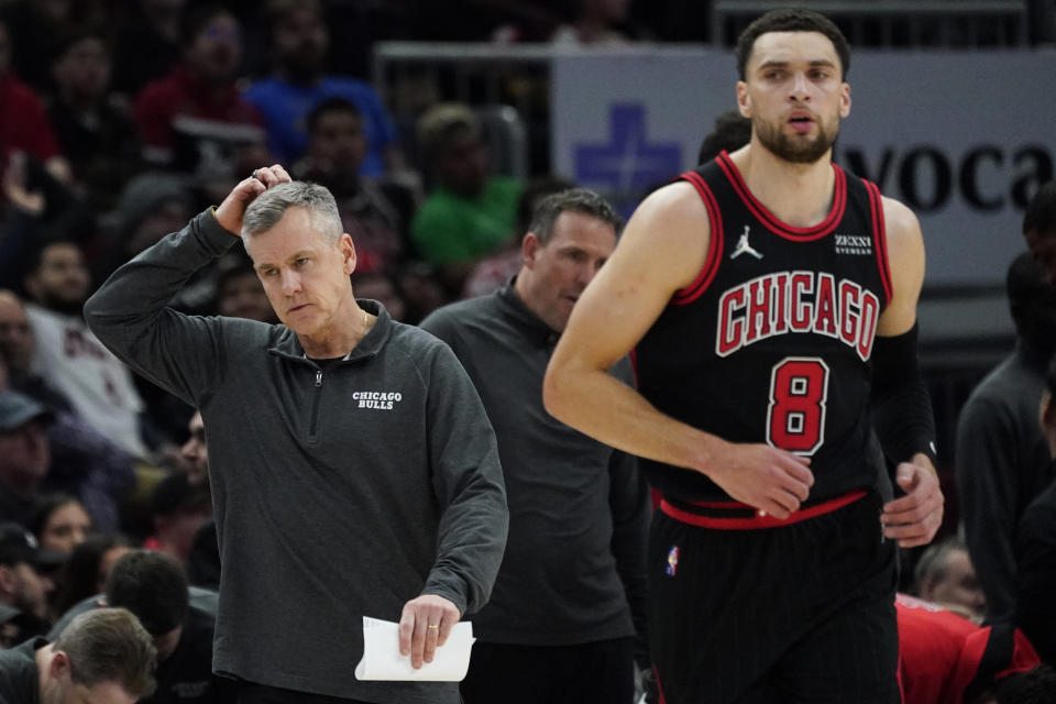 Chicago Bulls coach Billy Donovan, left, reacts after talking with guard Zach LaVine during the first half of the team's NBA basketball game against the Boston Celtics in Chicago, Wednesday, April 6, 2022. (AP Photo/Nam Y. Huh)