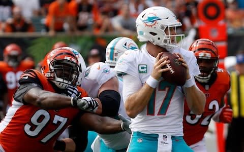 Miami Dolphins quarterback Ryan Tannehill (17) looks to throw against Cincinnati Bengals defensive tackle Geno Atkins (97) - Credit: (David Kohl/USA Today)