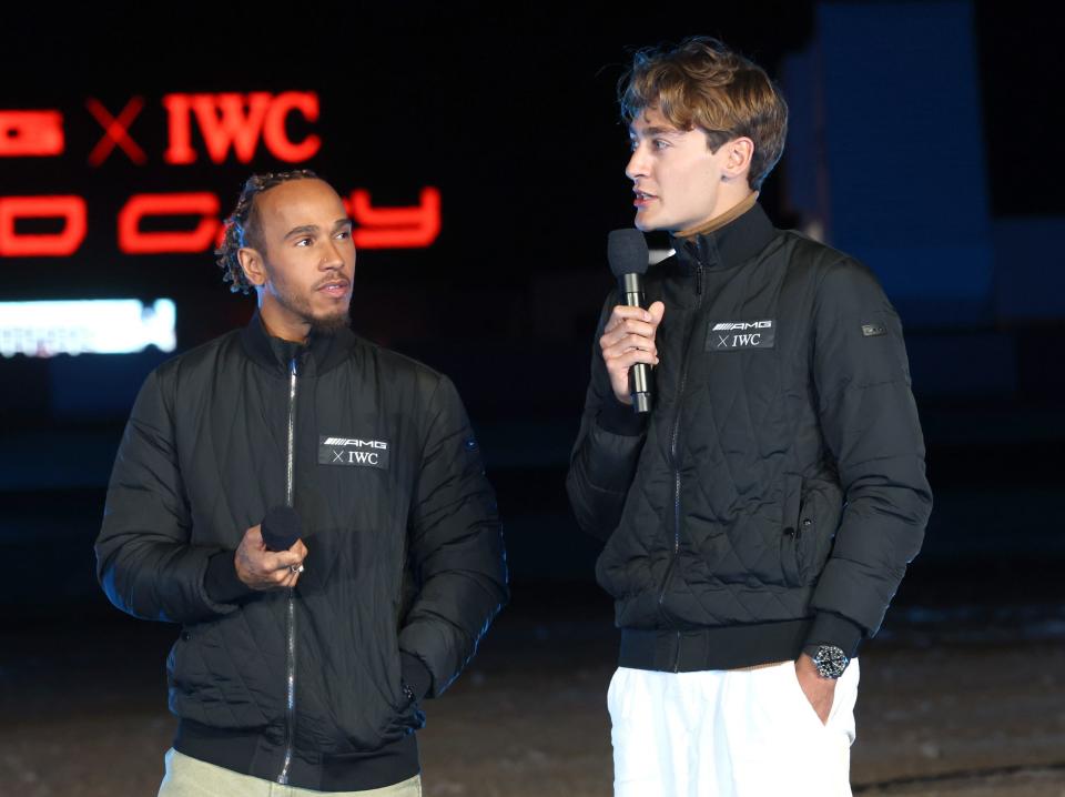 LAS VEGAS, NEVADA – NOVEMBER 14: (L-R) Lewis Hamilton and George Russell speak onstage at an exclusive event organized by IWC Schaffhausen and Mercedes-AMG at “Speed City” on November 14, 2023 in Las Vegas, Nevada. Ahead of the Grand Prix, Speed City is an outdoor desert camp and entertainment venue taking over the famous Speedvegas racetrack. (Photo by Phillip Faraone/Getty Images for IWC Schaffhausen)