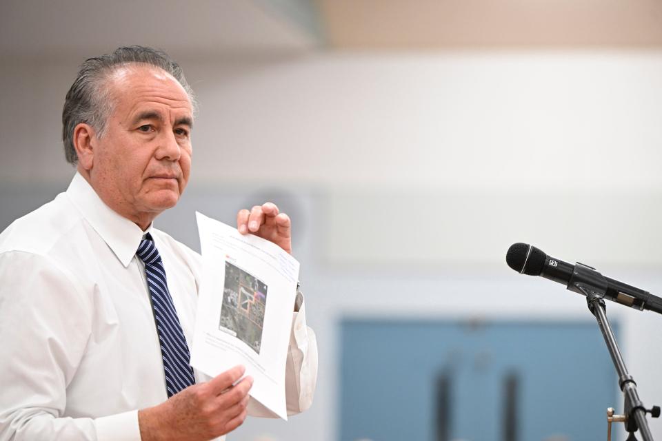 Venice Public Works Director Javier Vargas holds up a map showing where the city’s new water booster station will be located, while addressing the March 18 Venetian Golf and River Club Community Association annual meeting.