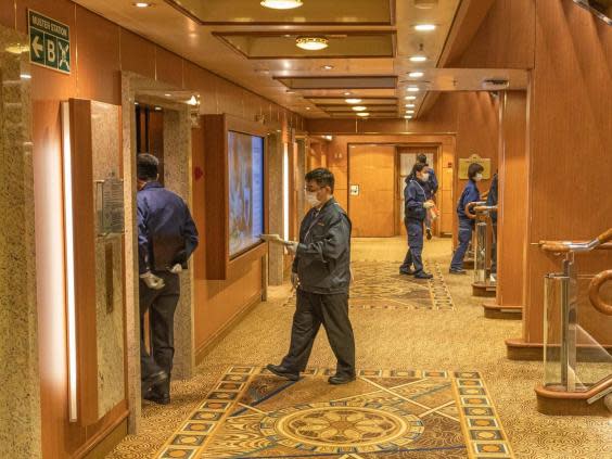 Quarantine officials on the Diamond Princess cruise ship that has been quarantined in Japan (PA)