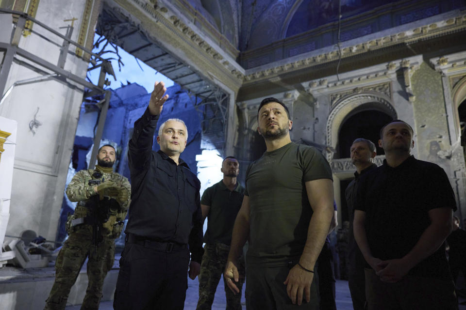 FILE - In this photo provided by the Ukrainian Presidential Press Office, Ukrainian President Volodymyr Zelenskyy, centre right, inspects damage of the Odesa Transfiguration Cathedral in Odesa, Thursday, July 27, 2023. (Ukrainian Presidential Press Office via AP, File)