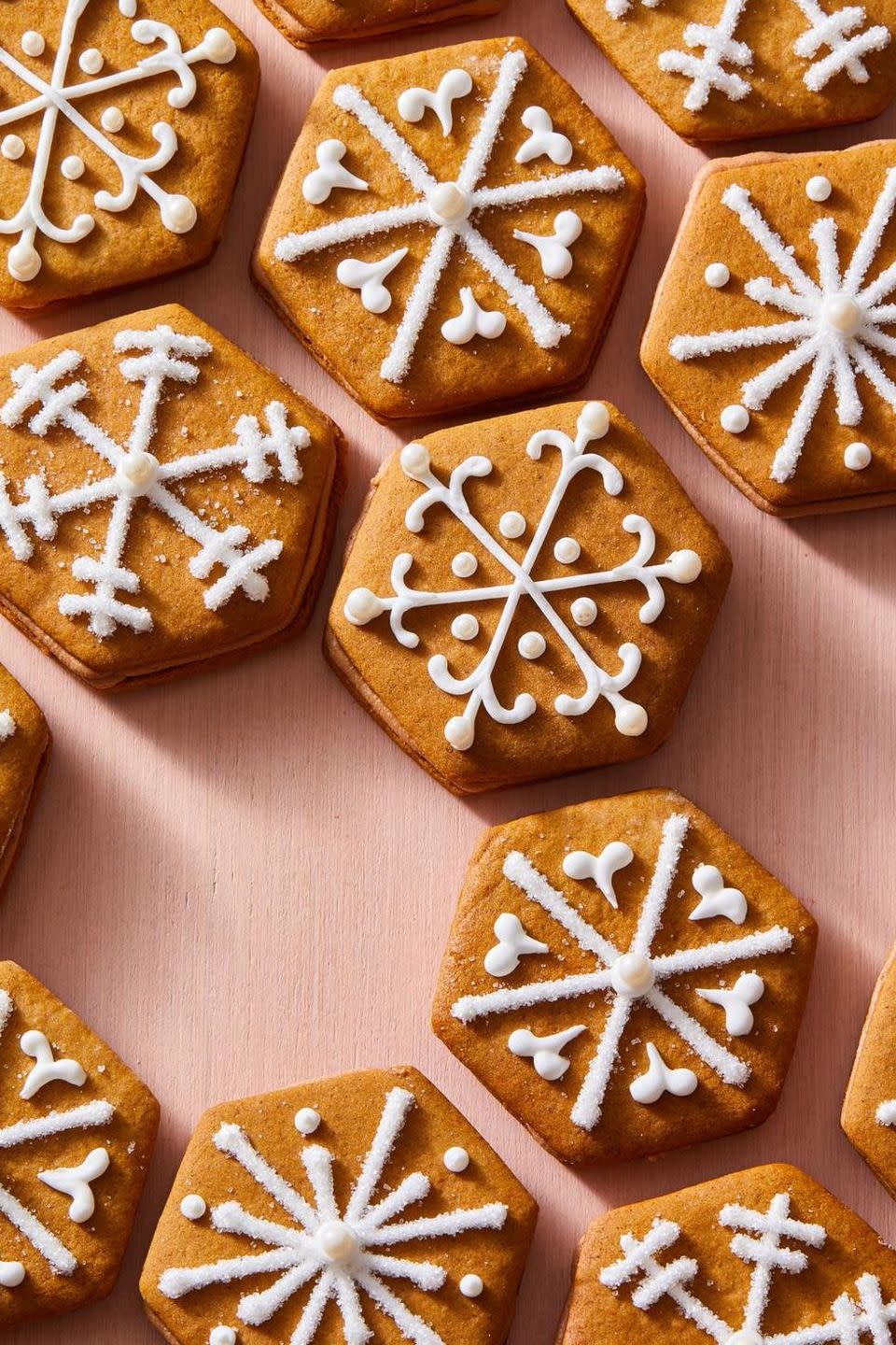 gingerbread sandwich cookies with white decorative frosting