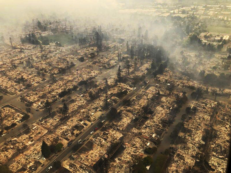 <p>This aerial photo provided by the California Highway Patrol Golden Gate Division shows some of hundreds of homes destroyed by a wind-driven wildfire that swept through Santa Rosa, Calif., early Monday, Oct. 9, 2017. (Photo: California Highway Patrol Golden Gate Division via AP) </p>