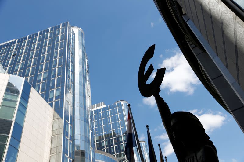 A sculpture with Euro symbol is pictured in front of the European Parliament in Brussels