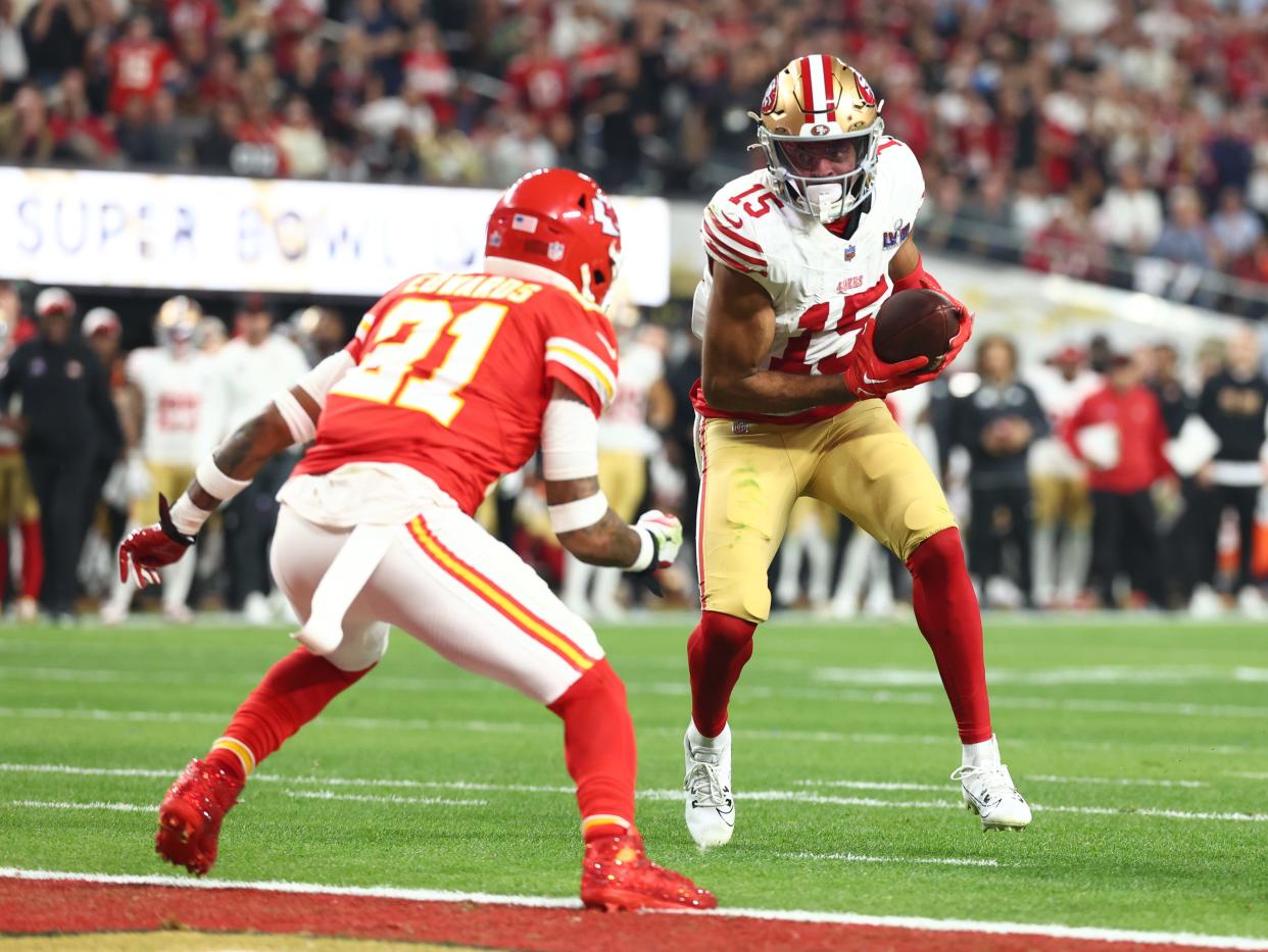 Feb 11, 2024; Paradise, Nevada, USA; San Francisco 49ers wide receiver Jauan Jennings (15) scores a touchdown against Kansas City Chiefs safety Mike Edwards (21) in the second half in Super Bowl LVIII at Allegiant Stadium. Mandatory Credit: Mark J. Rebilas-USA TODAY Sports