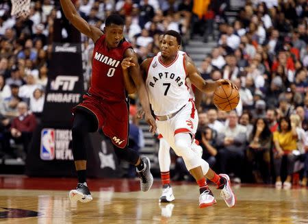 Jan 22, 2016; Toronto, Ontario, CAN; Toronto Raptors guard Kyle Lowry (7) tries to dribble past Miami Heat guard Josh Richardson (0) at the Air Canada Centre. Toronto defeated Miami 101-81. Mandatory Credit: John E. Sokolowski-USA TODAY Sports