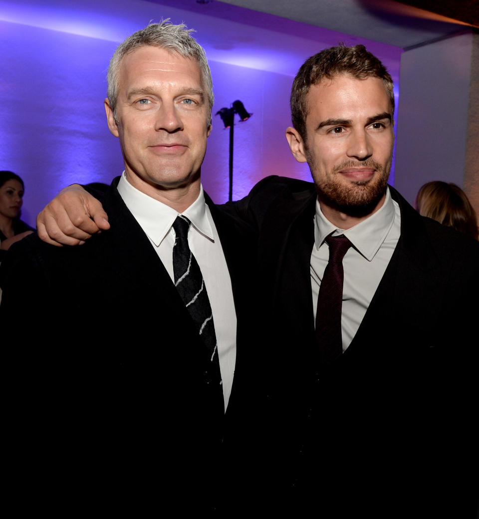 LOS ANGELES, CA - MARCH 18:  Director Neil Burger (L) and actor Theo James pose at the after party for the premiere of Summit Entertainment's 'Divergent' at The Armand Hammer Museum on March 18, 2014 in Los Angeles, California.  (Photo by Kevin Winter/Getty Images)