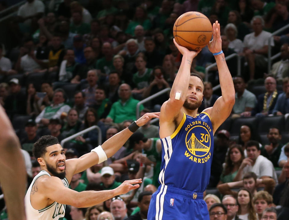 BOSTON, MA - June 16: Stephen Curry #30 of the Golden State Warriors hits a 3-pointer as Jayson Tatum #0 of the Boston Celtics tries to make the stop during the second half of Game 6 of the NBA Finals at the TD Garden on June 16, 2022 in Boston, Massachusetts.  (Photo by Matt Stone/MediaNews Group/Boston Herald via Getty Images)