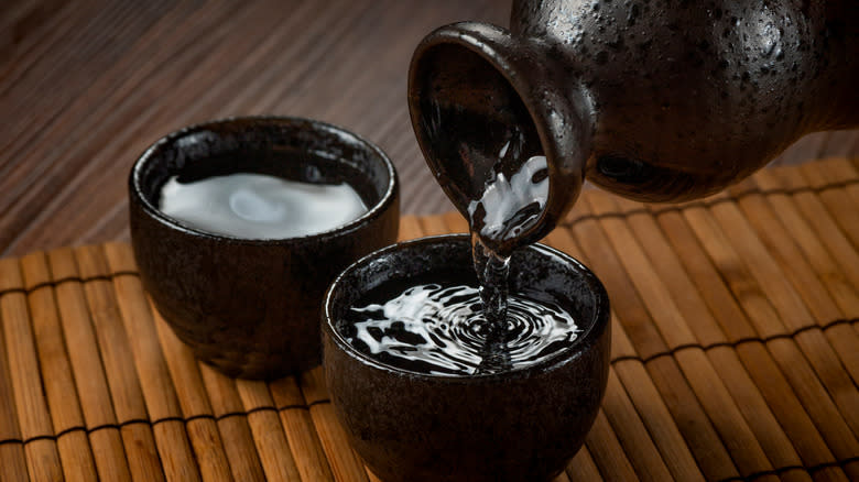 Sake being poured into cups