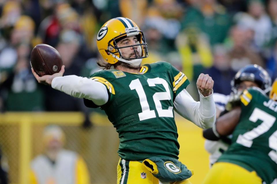 Green Bay Packers' Aaron Rodgers throws during the first half of an NFL football game against the Seattle Seahawks Sunday, Nov. 14, 2021, in Green Bay, Wis.