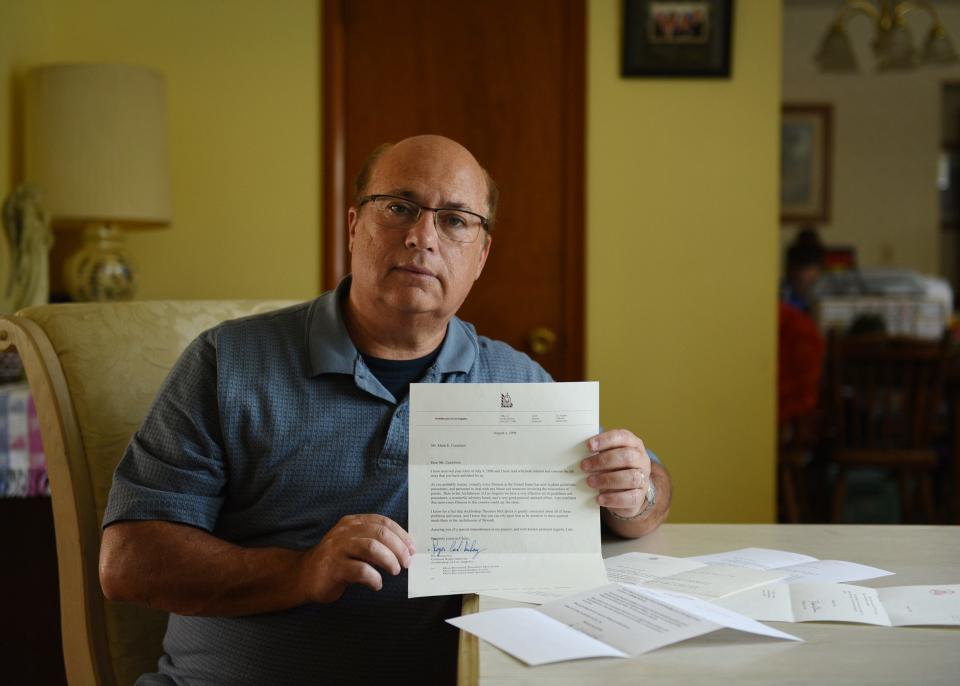 Mark Crawford ,57, of Avenel, NJ., the NJ head of the Survivors Network of Those Abused by Priests, known as SNAP, holds a letter from Cardinal Roger Mahoney, as well as other letters displayed on the table that he received from US cardinals of the Catholic Church in 1998 after telling them in a letter about being abused by Bayonne priest Ken Martin. Photographed at his home in Avenel on 08/05/20.