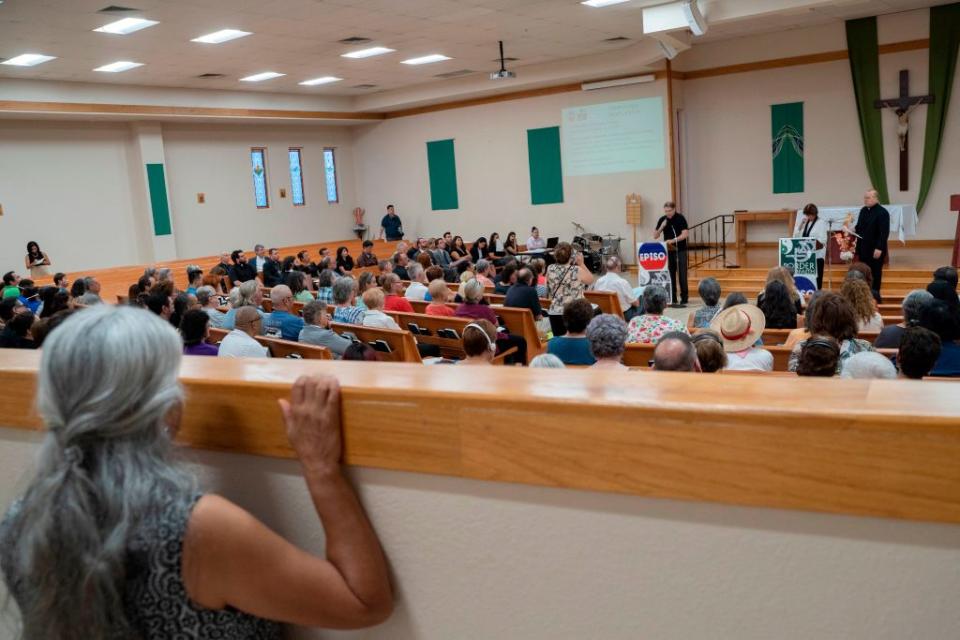Attendees are pictured during the El Paso Interreligious Sponsoring Organization's assembly at St. Paul the Apostle Catholic Church to help the community discuss their feelings in the wake of the mass shooting in El Paso, Texas on August 8, 2019. | PAUL RATJE—AFP/Getty Images