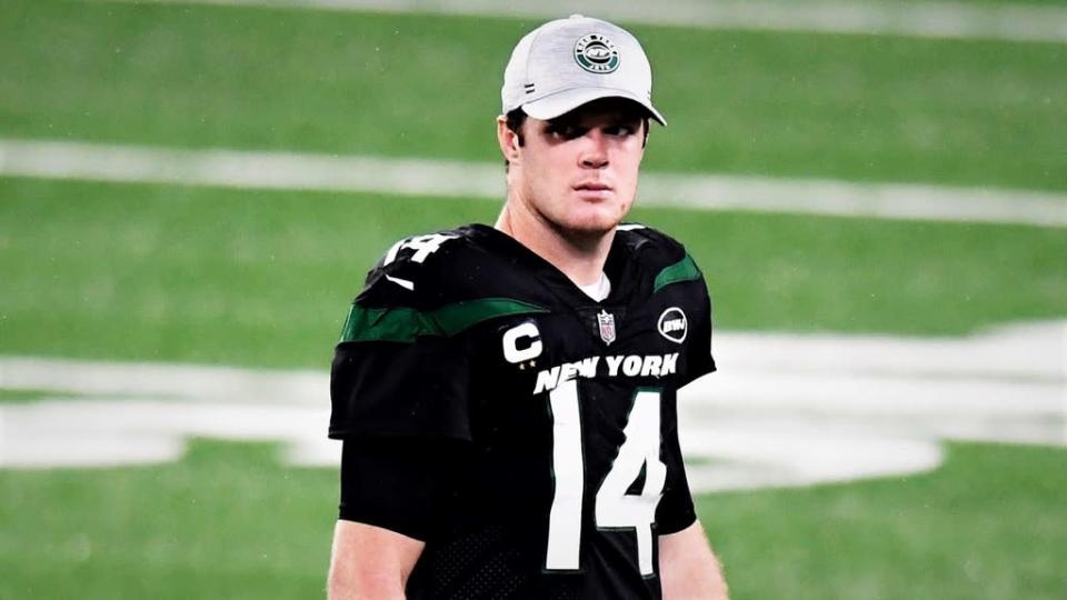 Sam Darnold wearing hat and black jersey after loss to Broncos