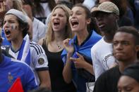 France team fans react as they watch the 2014 World Cup quarter-finals soccer match between France and Germany at the Maracana stadium in Rio de Janeiro, on a giant screen outside the city hall in Paris July 4, 2014. REUTERS/Gonzalo Fuentes