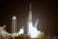 A SpaceX Falcon Heavy rocket, carrying the U.S. Air Force's Space Test Program 2 Mission, lifts off from the Kennedy Space Center in Cape Canaveral, Florida