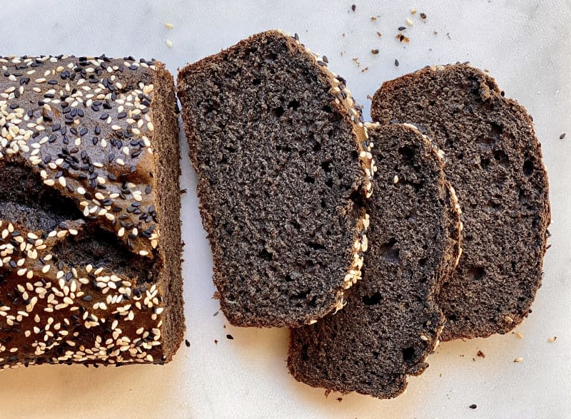 Loaf of Black Sesame Banana Bread, partially cut into slices