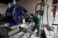 A worker of Psaltry International works on the production line of starch at a factory in Oyo