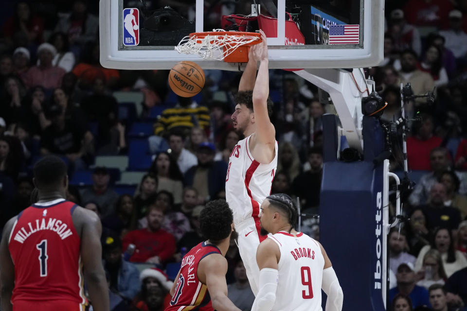 Houston Rockets center Alperen Sengun (28) slam dunks in the second half of an NBA basketball game against the New Orleans Pelicans in New Orleans, Saturday, Dec. 23, 2023. The Rockets won 106-104. (AP Photo/Gerald Herbert)