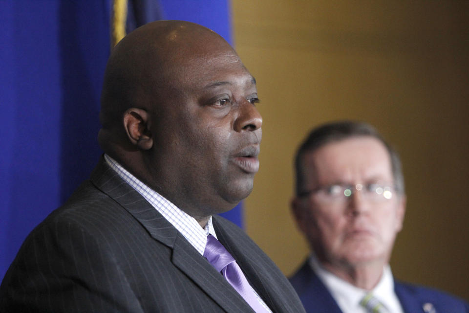 Syracuse Police Chief Kenton T. Buckner, left, speaks at a news conference at the Syracuse Police Department in Syracuse, N.Y., Thursday, Feb. 21, 2019, about Syracuse men's NCAA college basketball head coach Jim Boeheim's involvement in a fatal car accident where he struck and killed a man standing along an interstate in Syracuse. Boeheim struck and killed a man along an interstate late Wednesday night as he tried to avoid hitting the man's disabled vehicle, police say. (AP Photo/Nick Lisi)