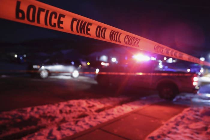 Police tape surrounds the crime scene in Enoch, Utah, where eight members of a family were found dead from gunshot wounds.