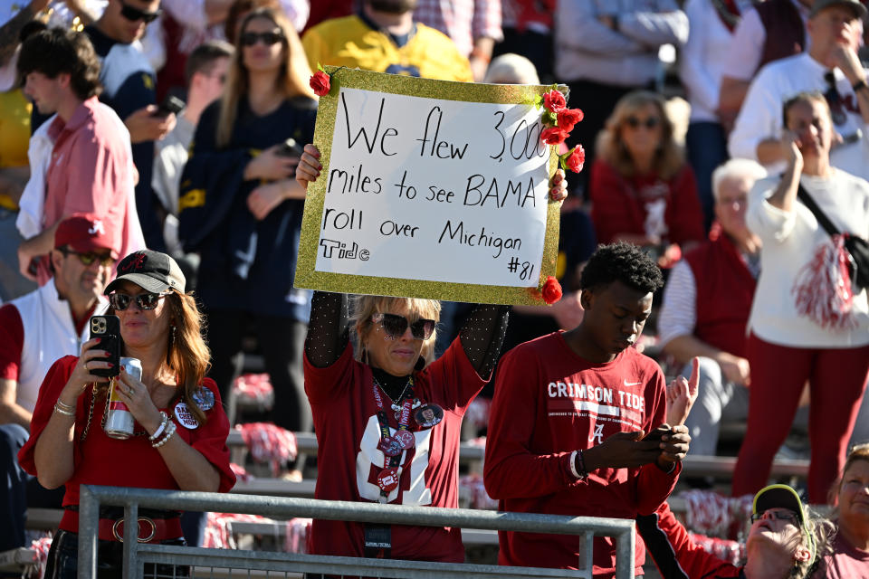 PASADENA, CA - JANUARY 01: Alabama fans hold signs showing their support for their team before the Alabama Crimson Tide game versus the Michigan Wolverines CFP Semifinal at the Rose Bowl Game on January, 1, 2024, at the Rose Bowl Stadium in Pasadena, CA. (Photo by John Cordes/Icon Sportswire via Getty Images)