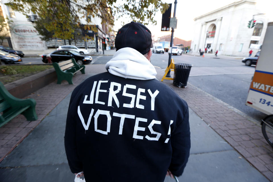 Ed Lippman, 58, wears a message on his jacket on Election Day while walking home, Tuesday, Nov. 6, 2012, in Hoboken, N.J. (AP Photo/Julio Cortez)