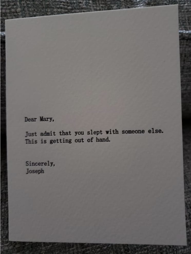 The card reads "Dear Mary, just admit that you slept with someone else. This is getting out of hand, sincerely Joseph"