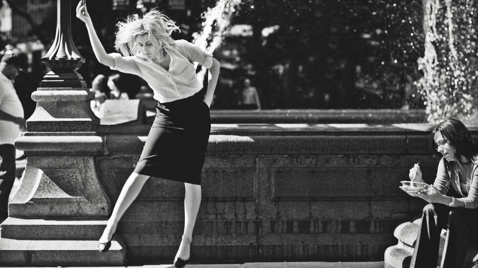 This undated publicity photo released by the Independent Film Channel shows Greta Gerwig, left, as Frances dancing in front of fountain in a scene from the film, "Frances Ha." (AP Photo/IFC)