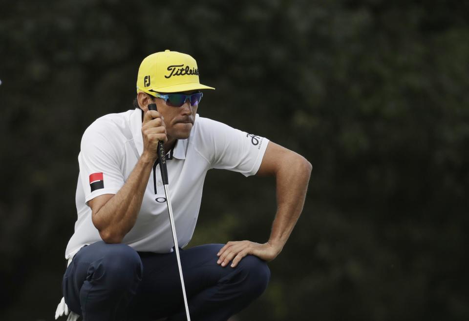 Rafa Cabrera Bello of Spain lines a putt on the 15th hole at the Hong Kong Open golf tournament in Hong Kong, Sunday, Dec. 11, 2016. Australia's Sam Brazel birdied the 18th hole to narrowly edge Cabrera Bello to capture the Hong Kong Open on Sunday, his first title on the European Tour. (AP Photo/Kin Cheung)