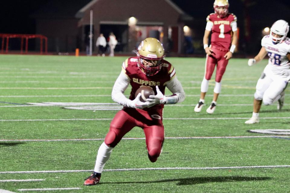 Portsmouth's Emmanuel Poe heads up field after a catch in the third quarter of Friday's Division I football game at Manchester Memorial. Poe had four catches for 46 yards on the night.