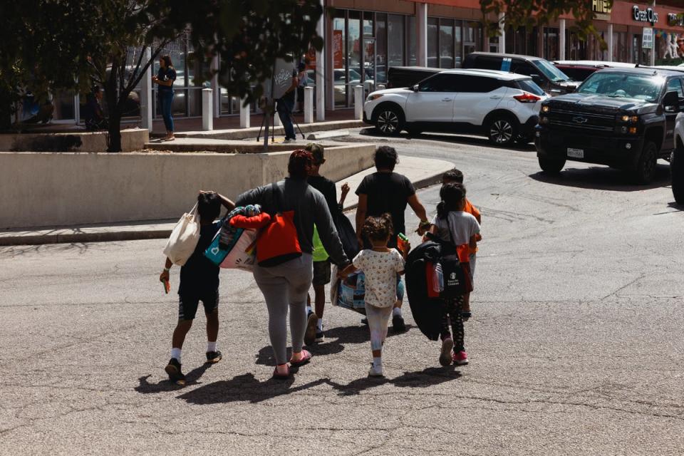 A family leaves the Migrant Resource Center in San Antonio, Texas on 19 September. (Getty Images)