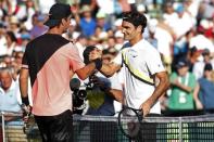 Mar 24, 2018; Key Biscayne, FL, USA; Thanasi Kokkinakis of Australia (L) shakes hands with Roger Federer of Switzerland (R) after their match on day five of the Miami Open at Tennis Center at Crandon Park. Mandatory Credit: Geoff Burke-USA TODAY Sports