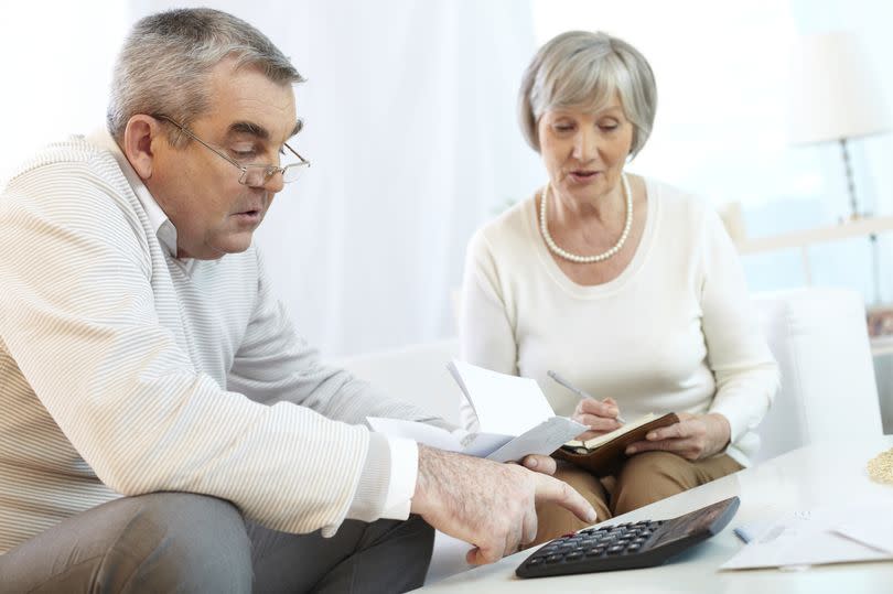 A pensioner couple checking their finances