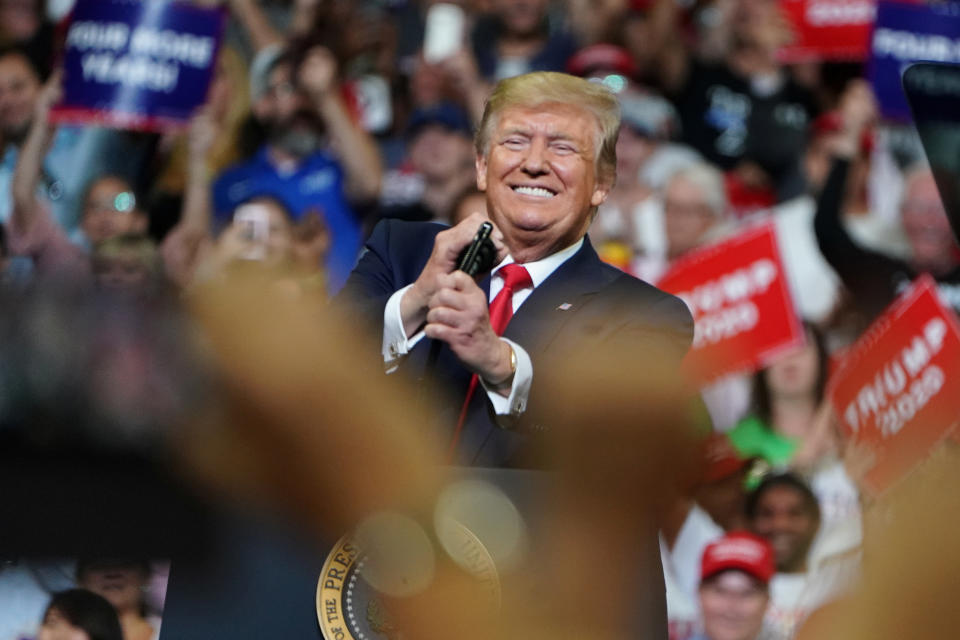 President Trump smiles before he speak at a campaign rally in Orlando, Fla., on Tuesday. (Carlo Allegri/Reuters)