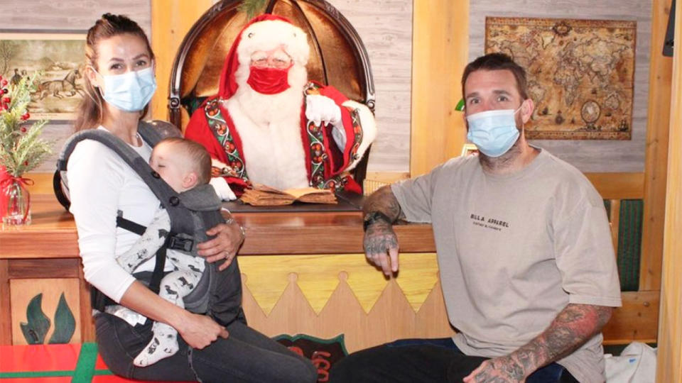 Pictured here, Dane Swan and his family get their Christmas photo taken with Santa.