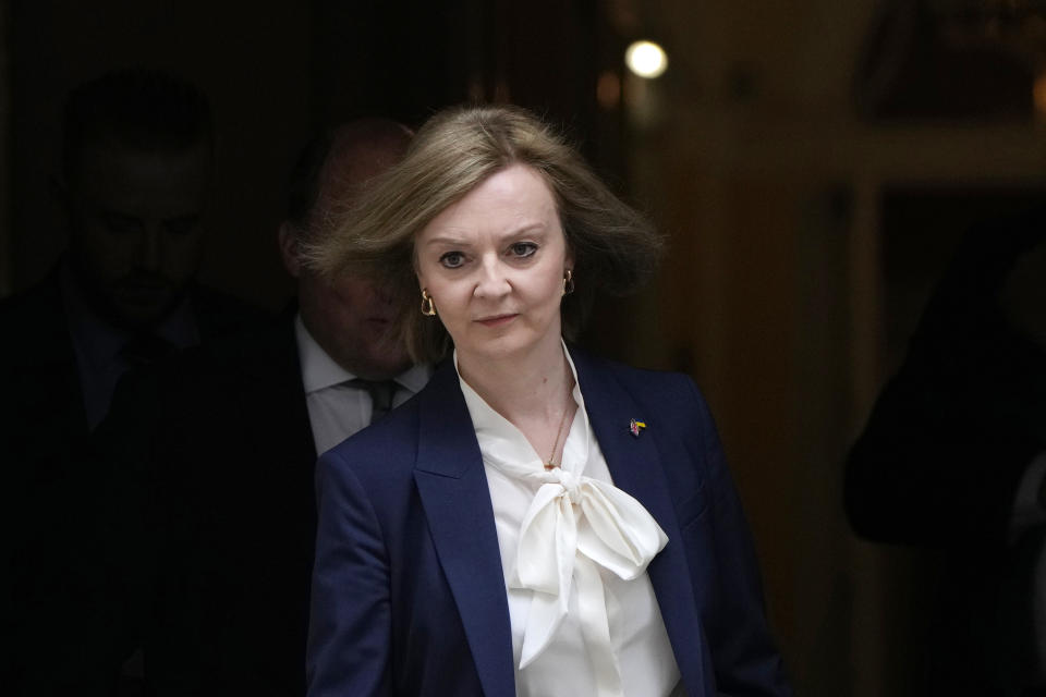 FILE - Liz Truss, Britain's Foreign Secretary leaves a Cabinet meeting at 10 Downing Street in London, Tuesday, April 19, 2022. Two people are running to be Britain’s next prime minister, but a third presence looms over the contest: Margaret Thatcher. Almost a decade after her death, the late former prime minister casts a powerful spell over Britain's Conservative Party. In the race to replace Boris Johnson as Conservative leader and prime minister, both Foreign Secretary Liz Truss and former Treasury chief Rishi Sunak claim to embody the values of Thatcher. (AP Photo/Alastair Grant, File)