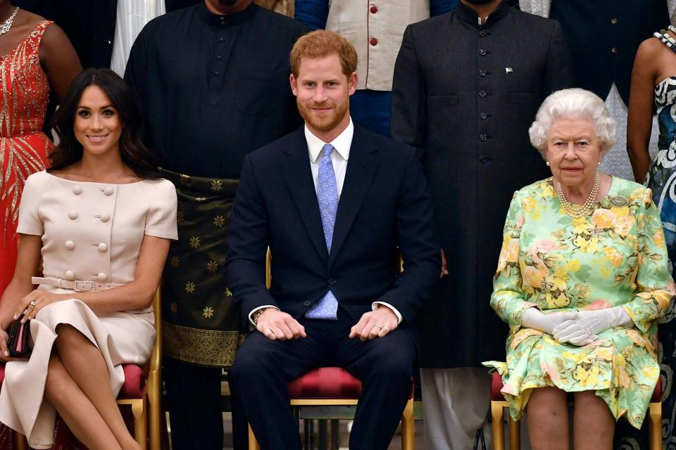 Queen Elizabeth, Prince Harry and Meghan, Duchess of Sussex (AP)