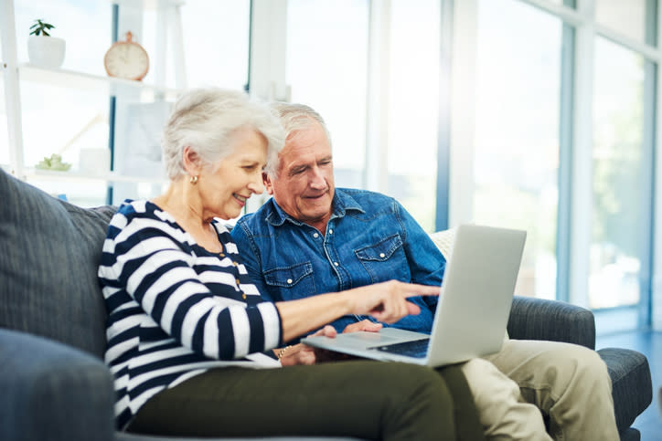 A senior couple reviews their estate plan.