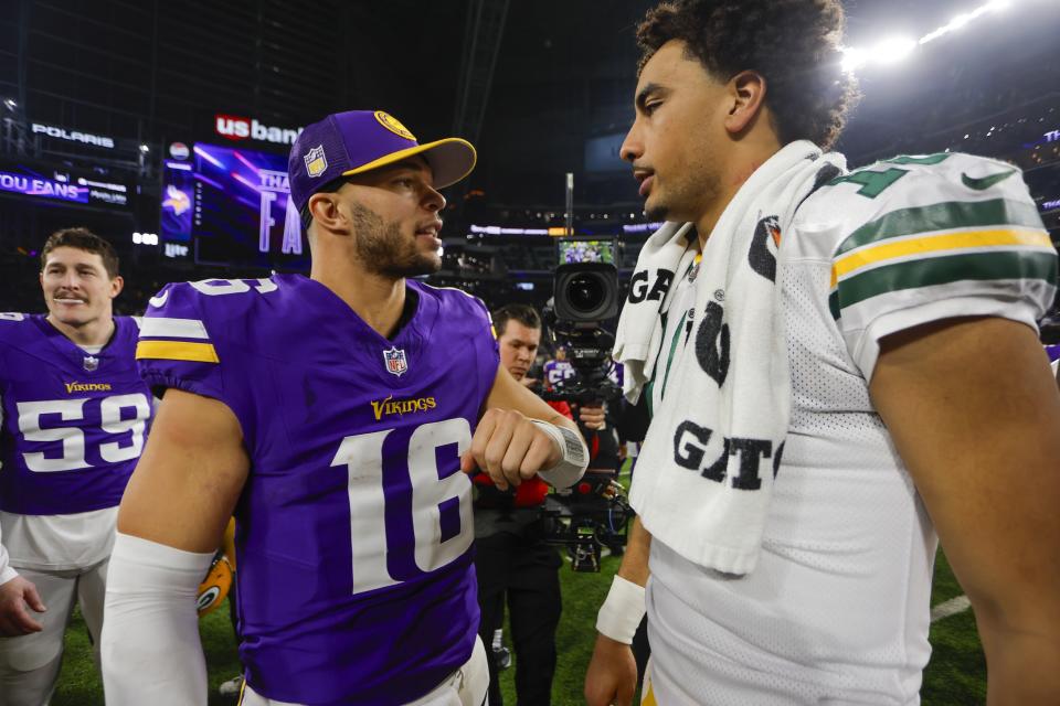 Green Bay Packers' Jordan Love talks to Minnesota Vikings' Jaren Hall after an NFL football game Sunday, Dec. 31, 2023, in Minneapolis. The Packers won 33-10. (AP Photo/Bruce Kluckhohn)