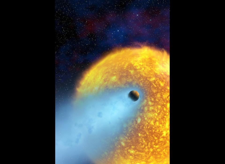 Artist's conception released by NASA of extrasolar planet HD 209458 b, also known as Osiris, orbiting its star in the constellation Pegasus, some 150 light-years from Earth's solar system. Scientists have used an infrared spectrum -- the first ever obtained for an extrasolar planet -- to analyze Osiris' atmosphere, which is said to contain dust but no water. The planet's surface temperature is more than 700 Celsius (1330 Fahrenheit).