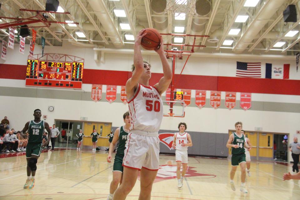 DCG's Calix Cahill puts up a shot during a game against Pella on Friday, Feb. 10, 2023, in Grimes.